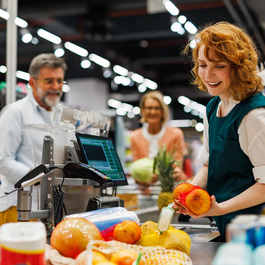 people checking out at grocery store